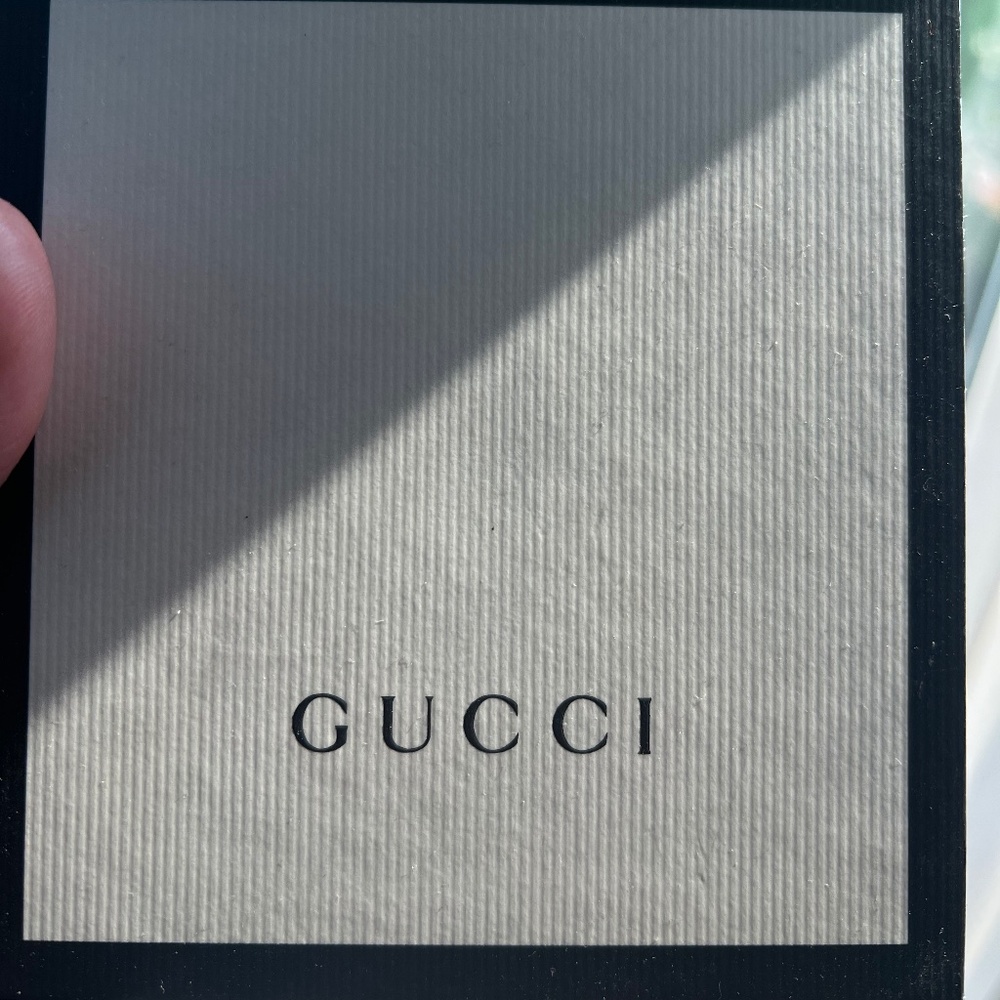 Woman’s Black Gucci Watch